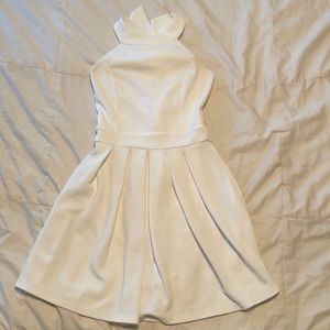 Dress with high neck and bow detail